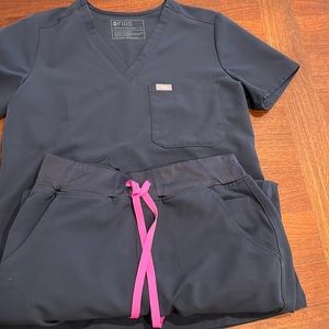 Figs blue scrubs.  May be Dark Harbor?